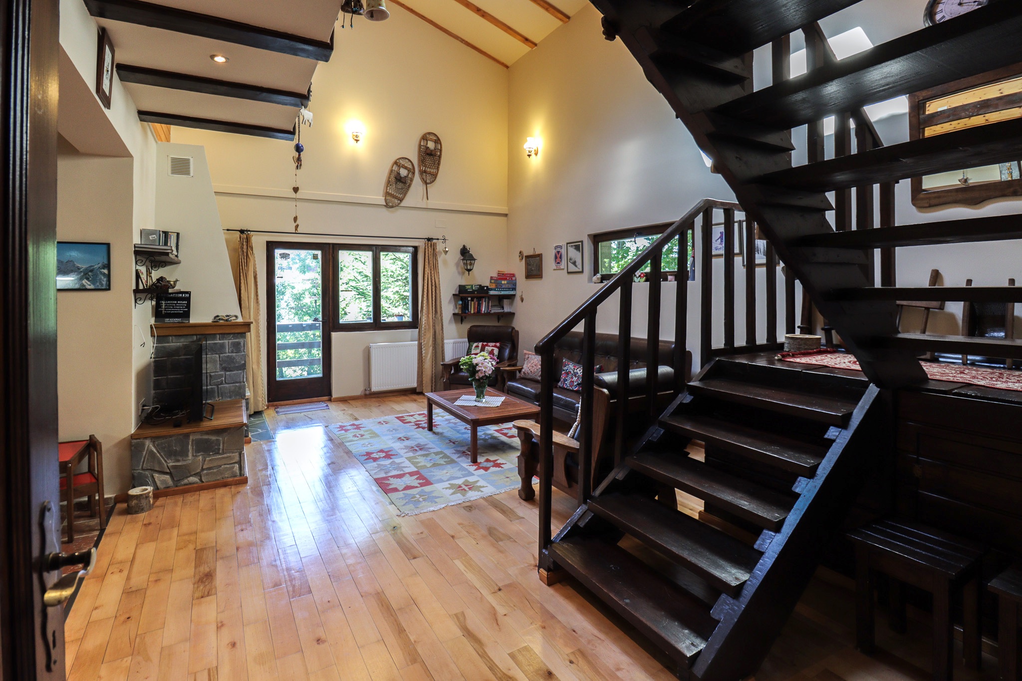 Living room with spiral staircase leading to the upper floor