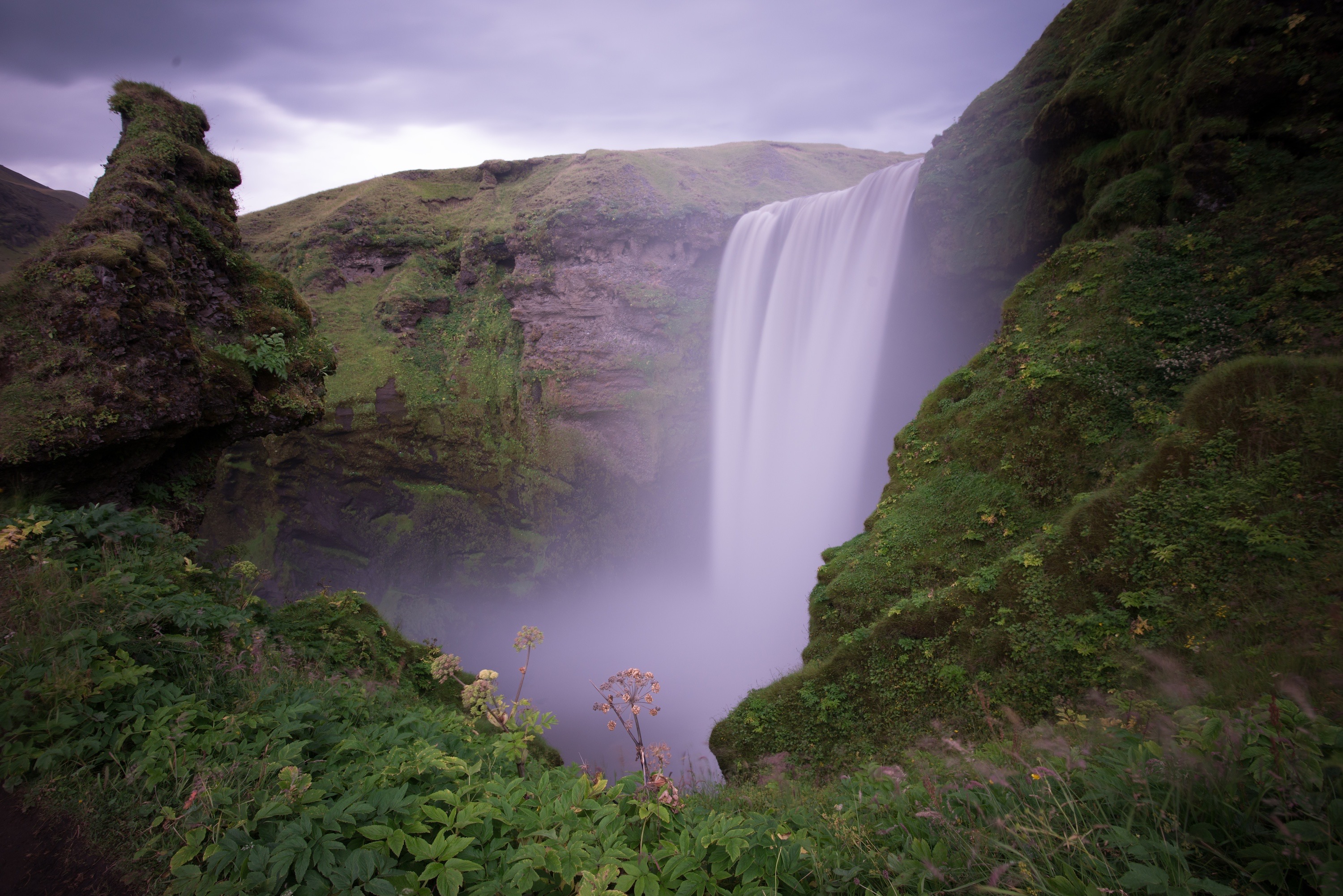 Majestic Waterfall in Lush Green Surroundings