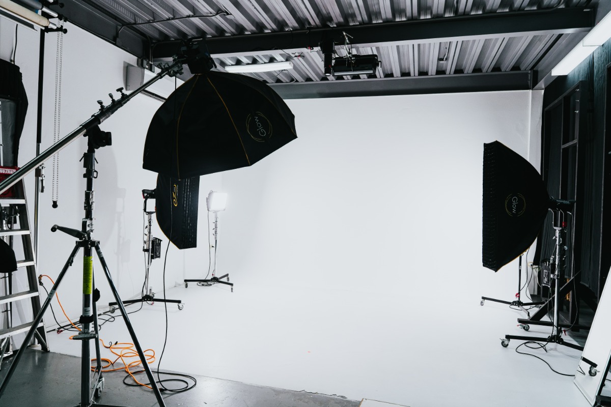 AI Studios white cyclorama with studio lights and softboxes