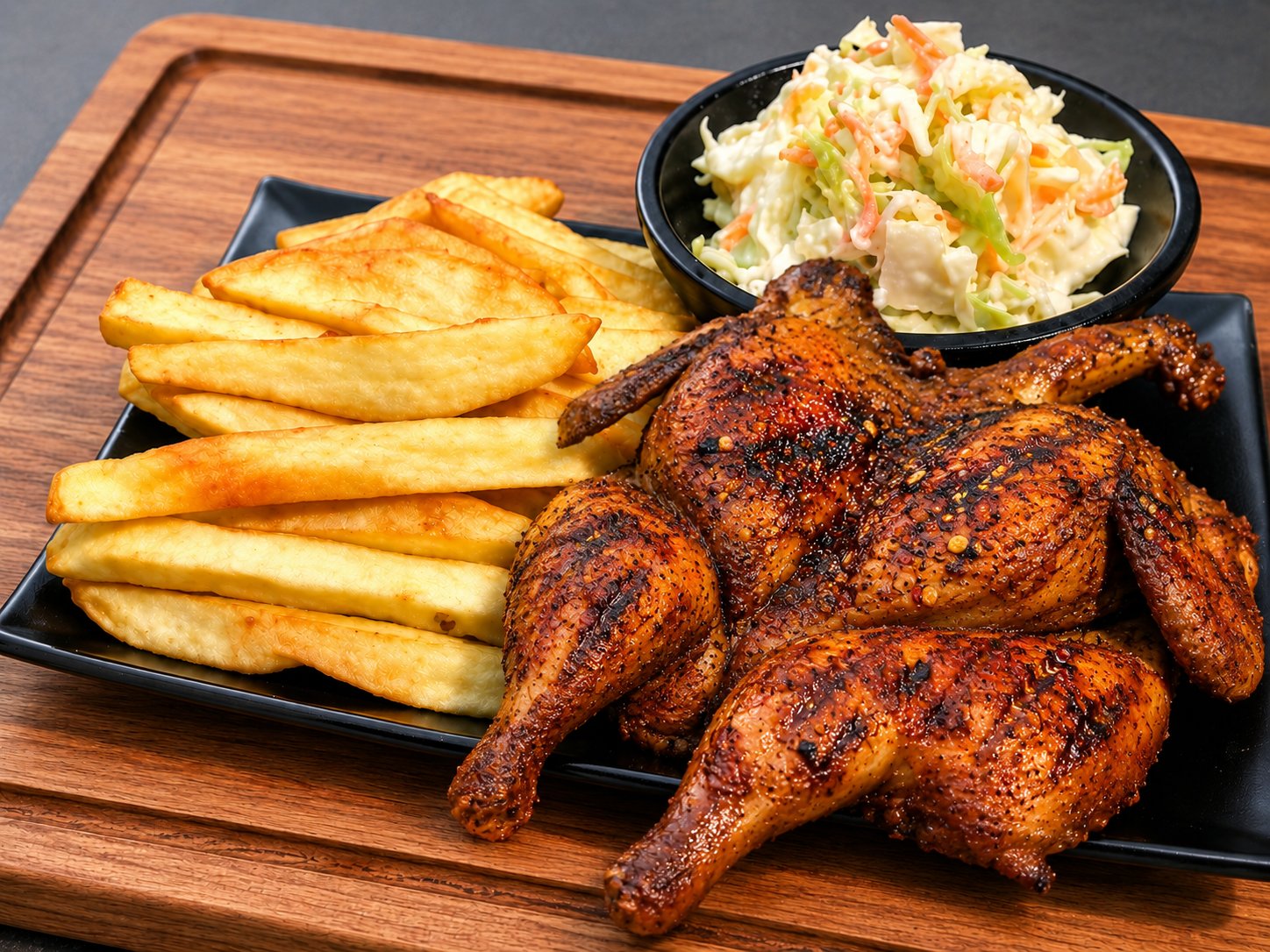 Full grilled chicken with chips and salad.