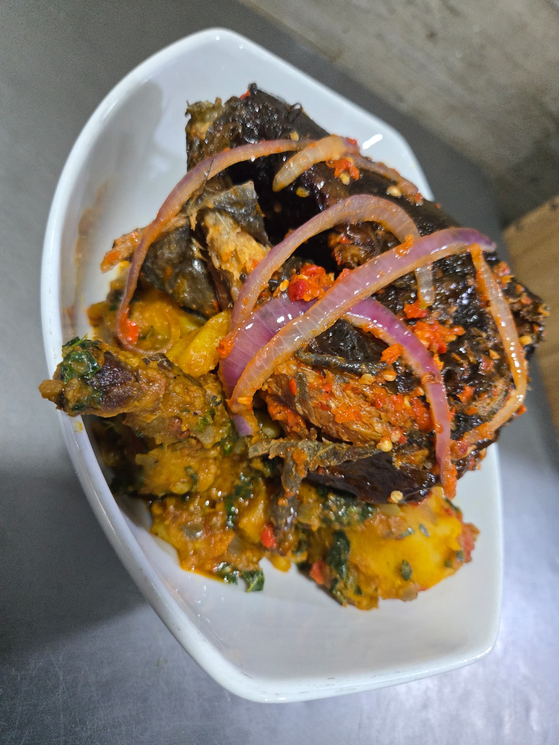 Yam porridge with peppered fish