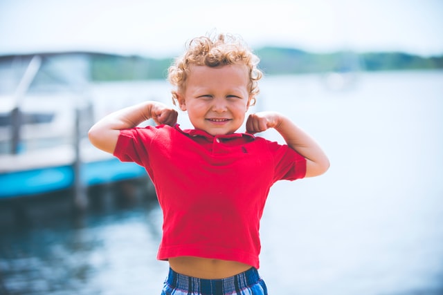 Boy showing muscles