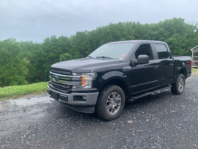 2019 Ford F-150 SXT — rebuilt & branded title, 10% below market