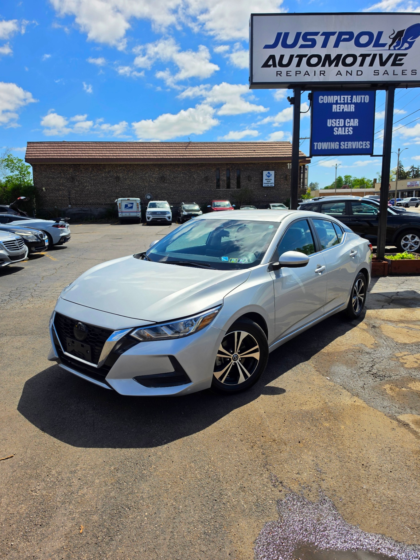 2023 Nissan Sentra SV — rebuilt & branded title, 18% below market