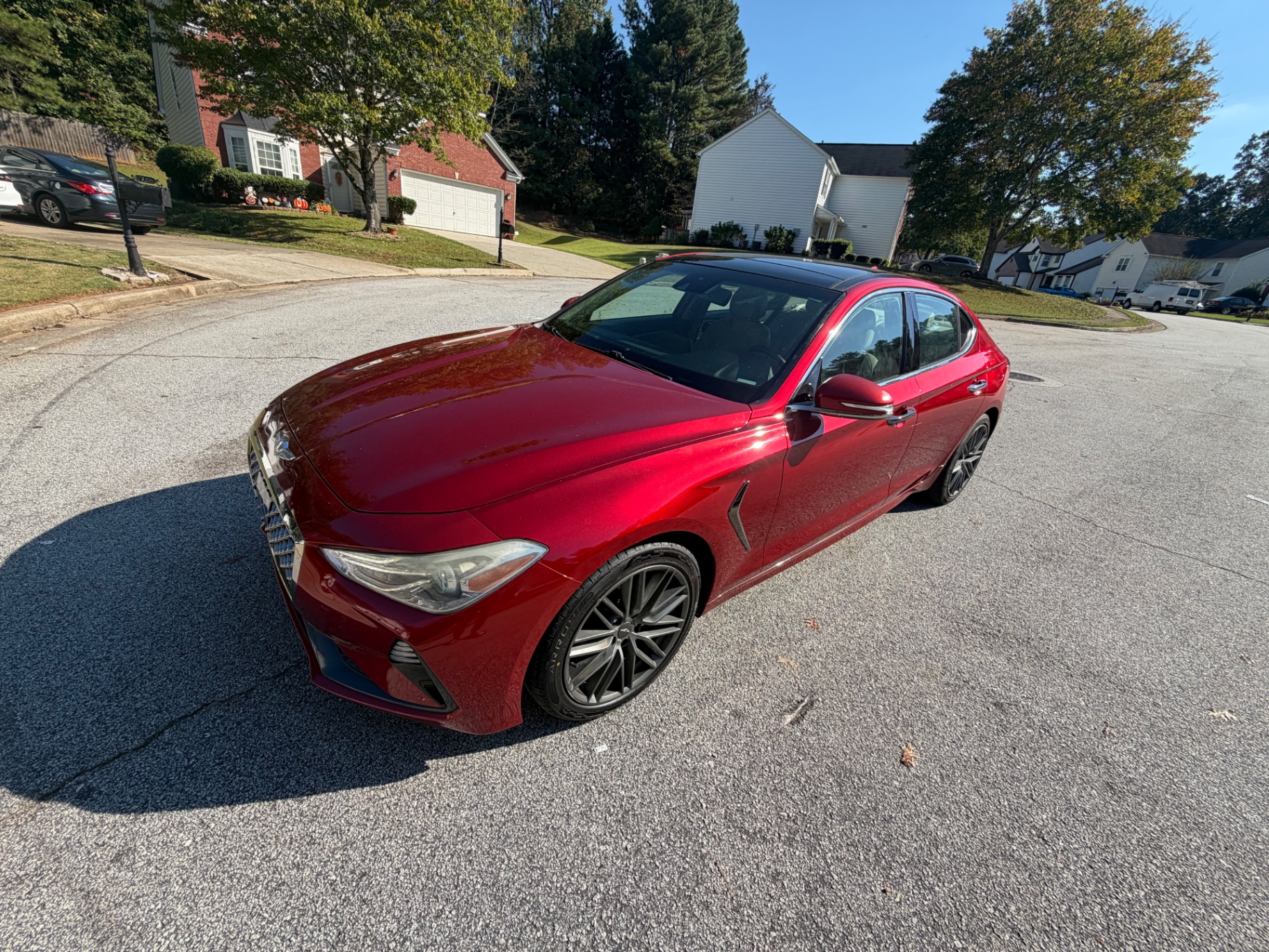 2019 Genesis G70 2.0t — rebuilt & branded title, 22% below market