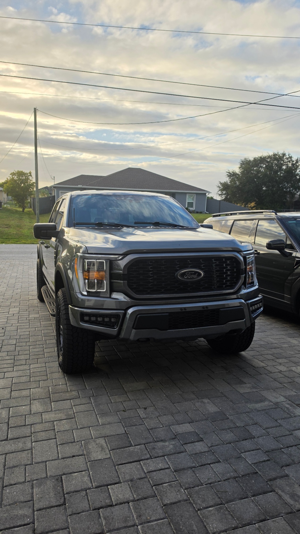 2023 Ford F-150 XLT — rebuilt & branded title, 26% below market