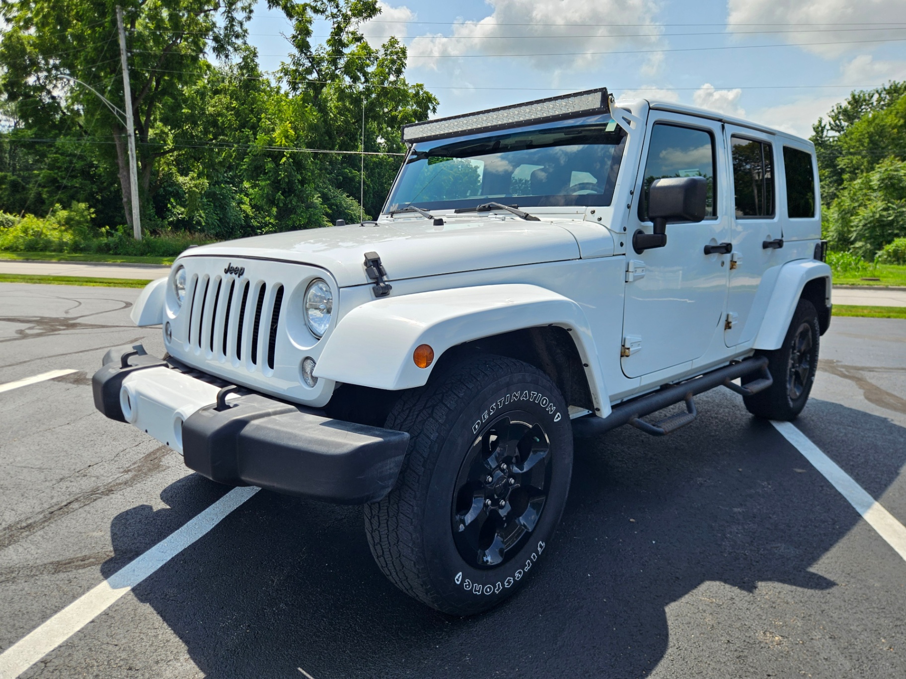 2015 Jeep Wrangler UNLIMITED SAHARA — rebuilt & branded title, 11% below market