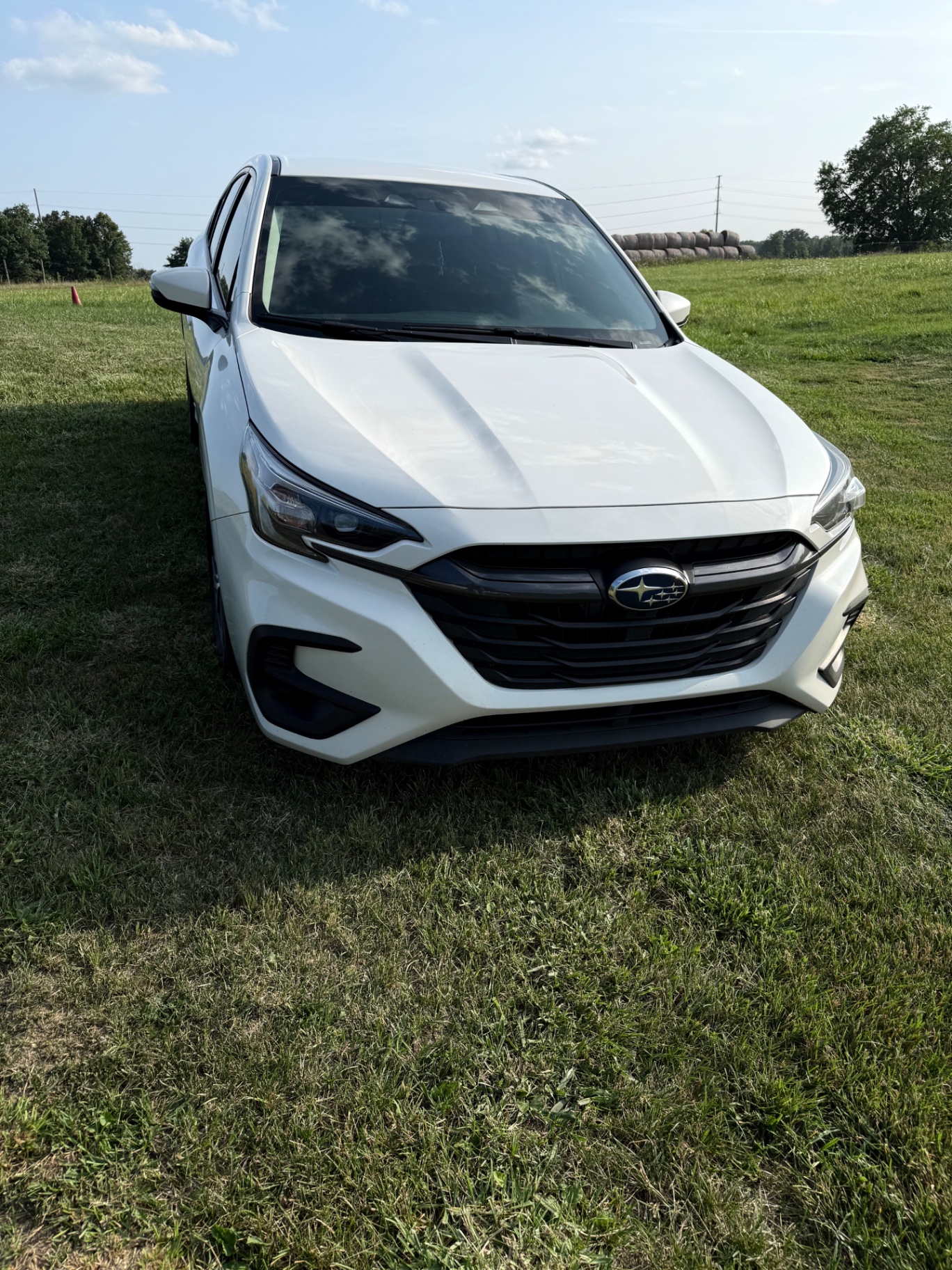 2024 Subaru Legacy Premium — rebuilt & branded title, 13% below market