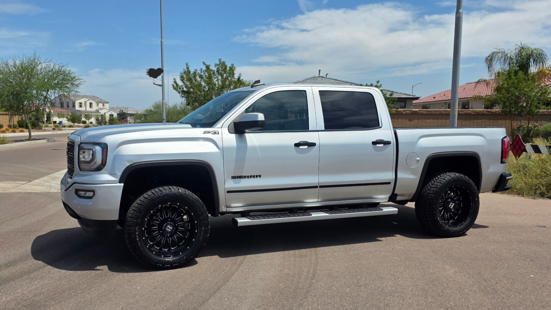 2018 GMC Sierra SLT — rebuilt & branded title, 7% below market