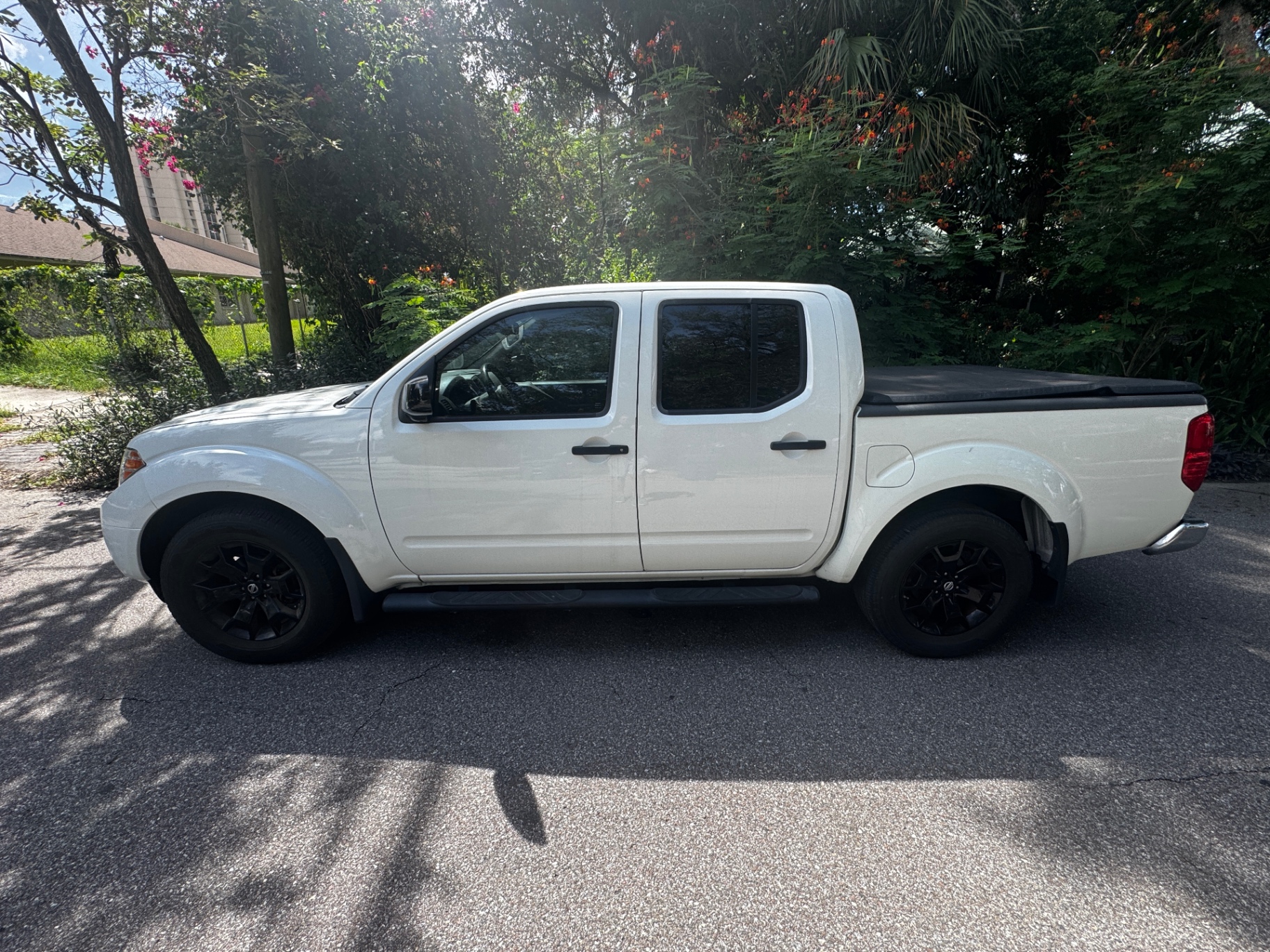 2019 Nissan Frontier SV — rebuilt & branded title, 28% below market