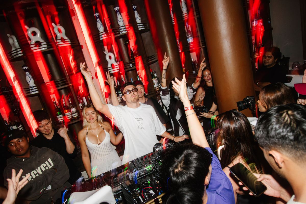 Crowd view of a live dj playing at Rhodes Bangkok