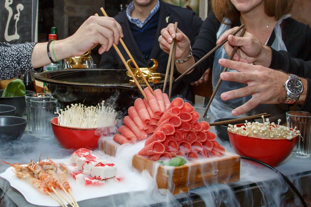 Friends sharing late night Chinese hotpot 