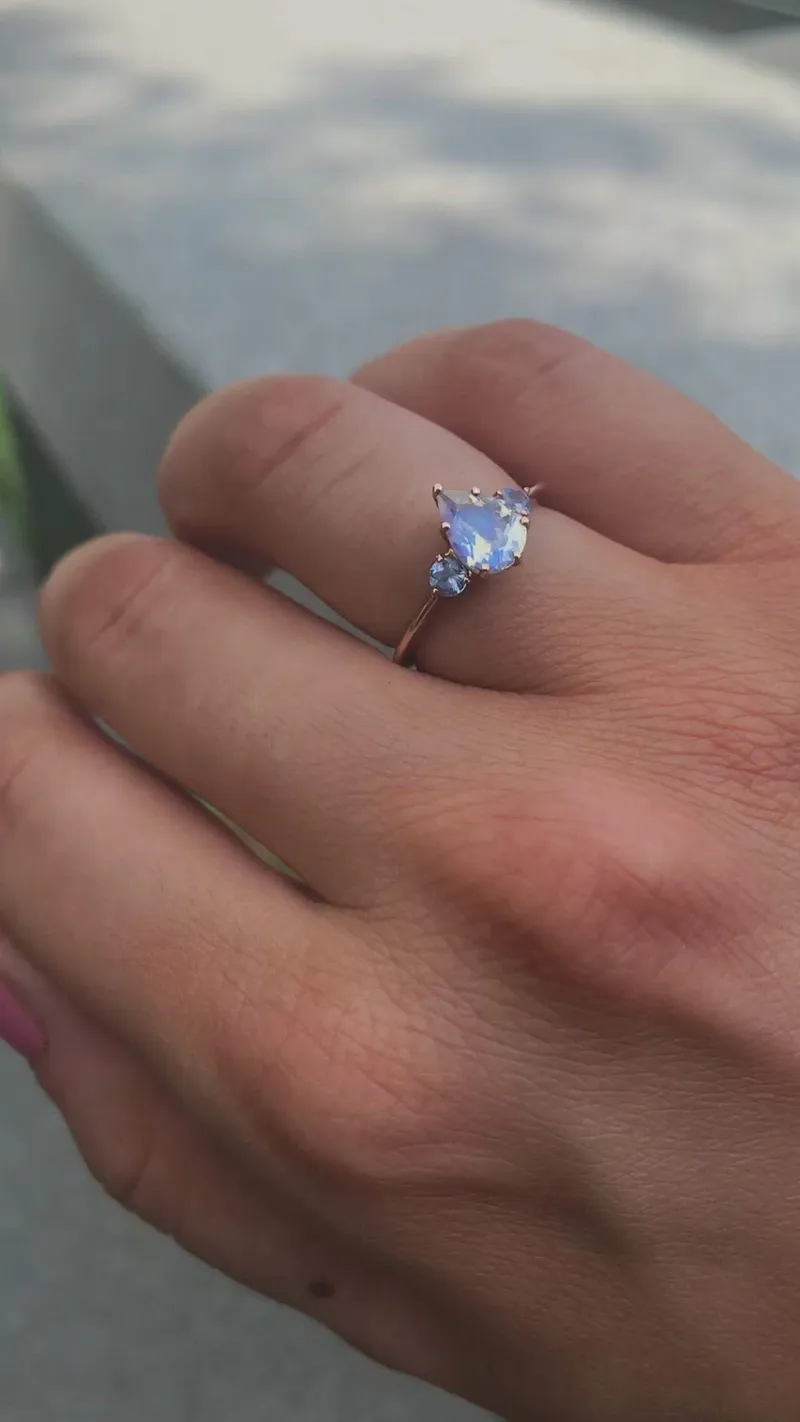 Pear Rainbow Moonstone Ring With Light Blue Sapphires view 12