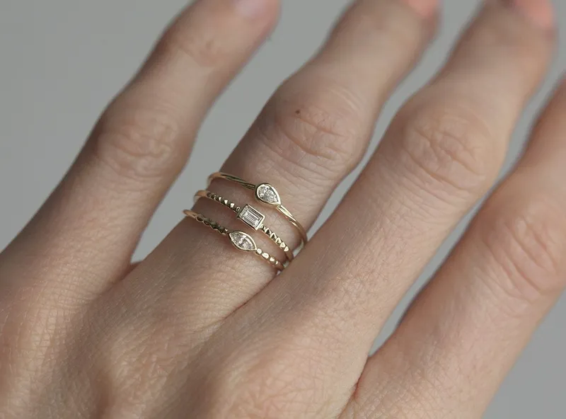 DELICATE BAGUETTE DIAMOND RING YELLOW GOLD BAND view 2