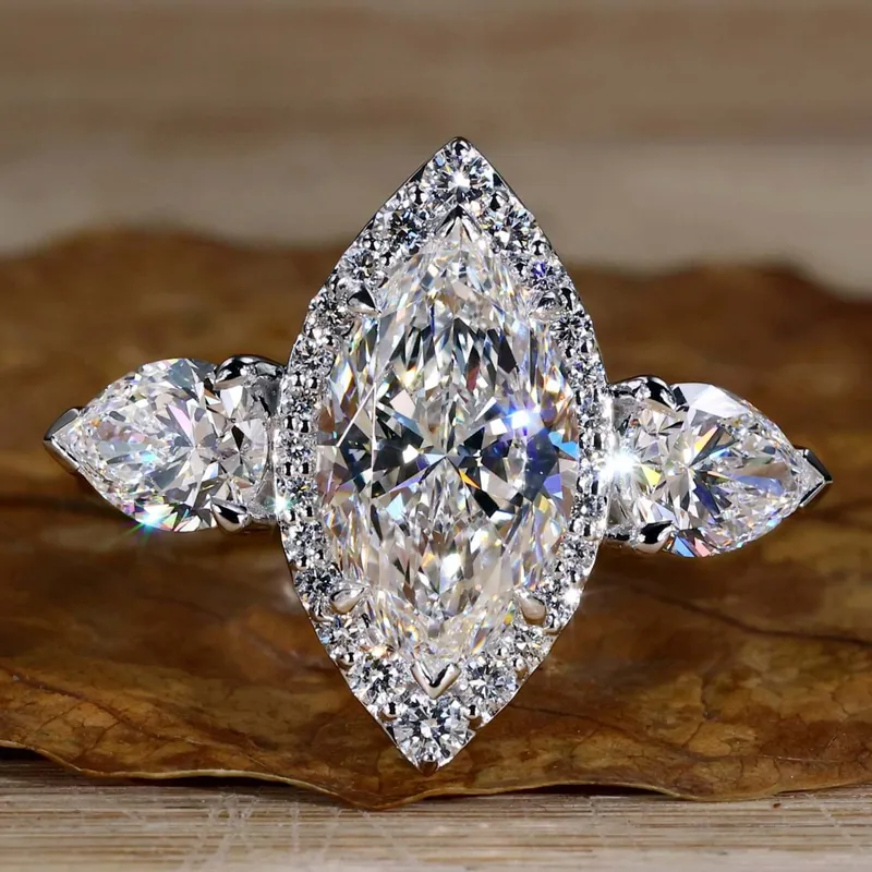 Marquise and Pear Cut Lab Grown Diamond Three Stone Engagement Ring pear cut engagement ring