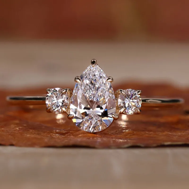 Pear and Round Three Stone Lab Grown Diamond Engagement Ring pear cut engagement ring