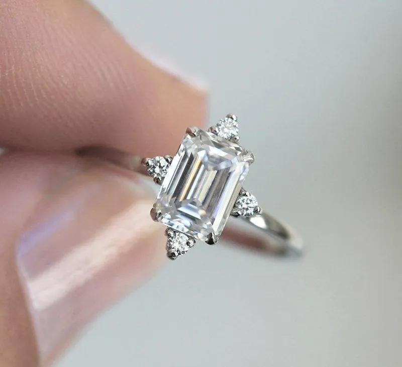 EMERALD CUT MOISSANITE RING IN WHITE GOLD WITH DIAMONDS diamond emerald cut engagement ring