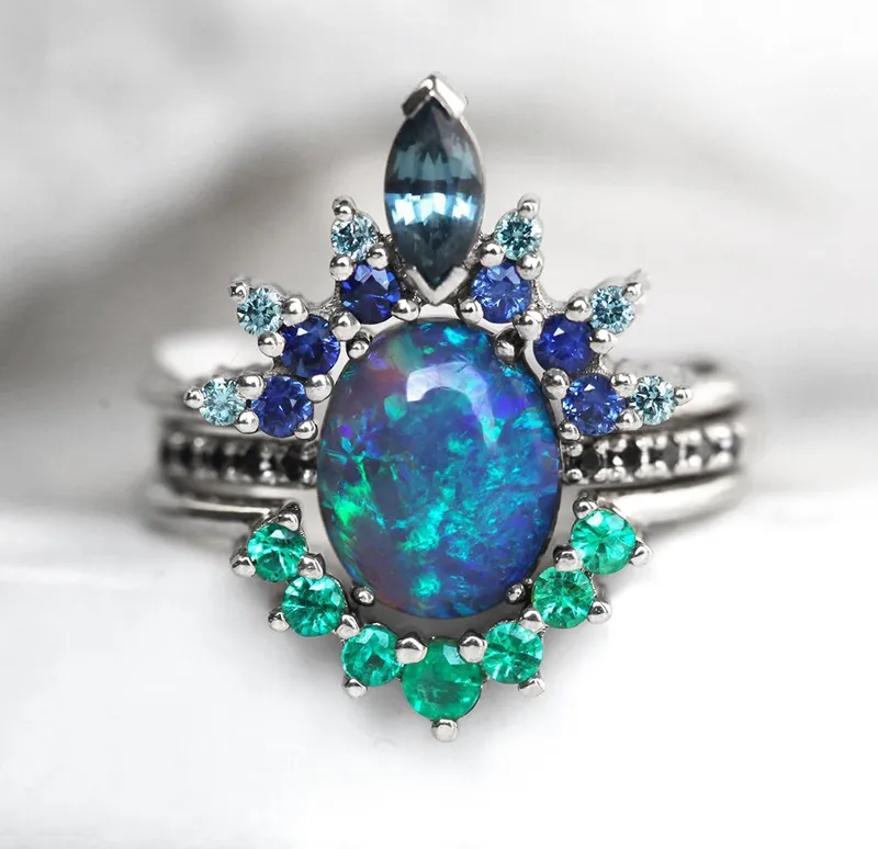 Emmeline Black Opal Lagoon Engagement Ring Set blue oval cut engagement ring