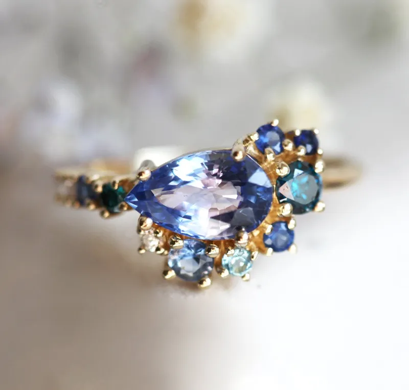 Freyja Blue Sapphire Emerald Topaz Diamond Cluster Ring blue sapphire pear cut engagement ring