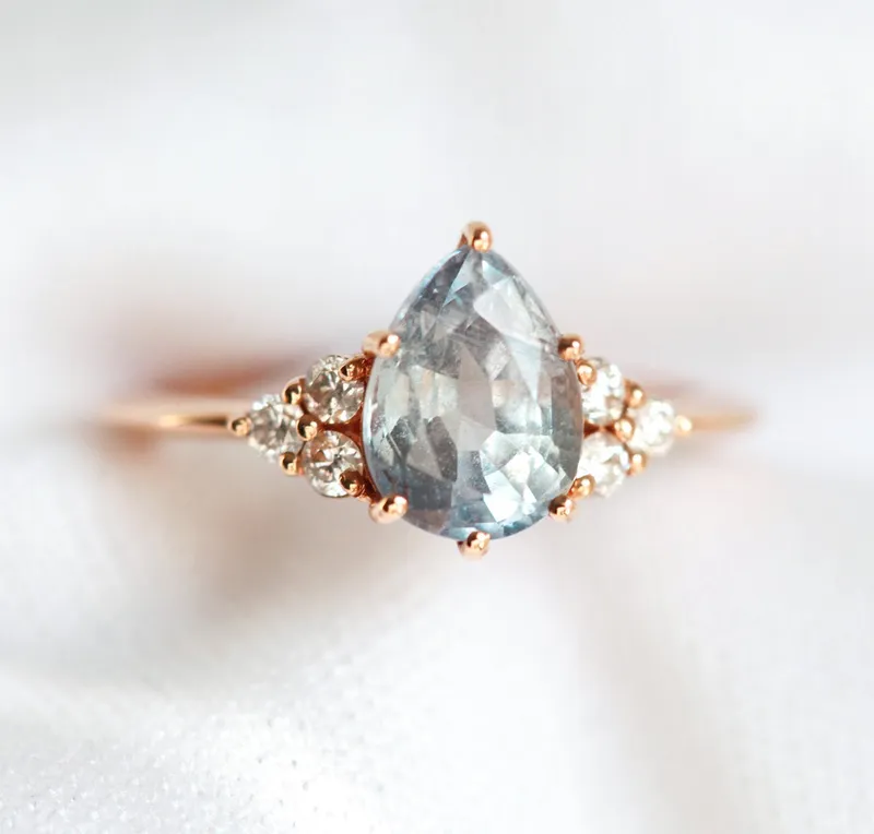 Jeanie Silvery Blue-Green Sapphire Ring W/ Diamond Clusters sapphire pear cut engagement ring