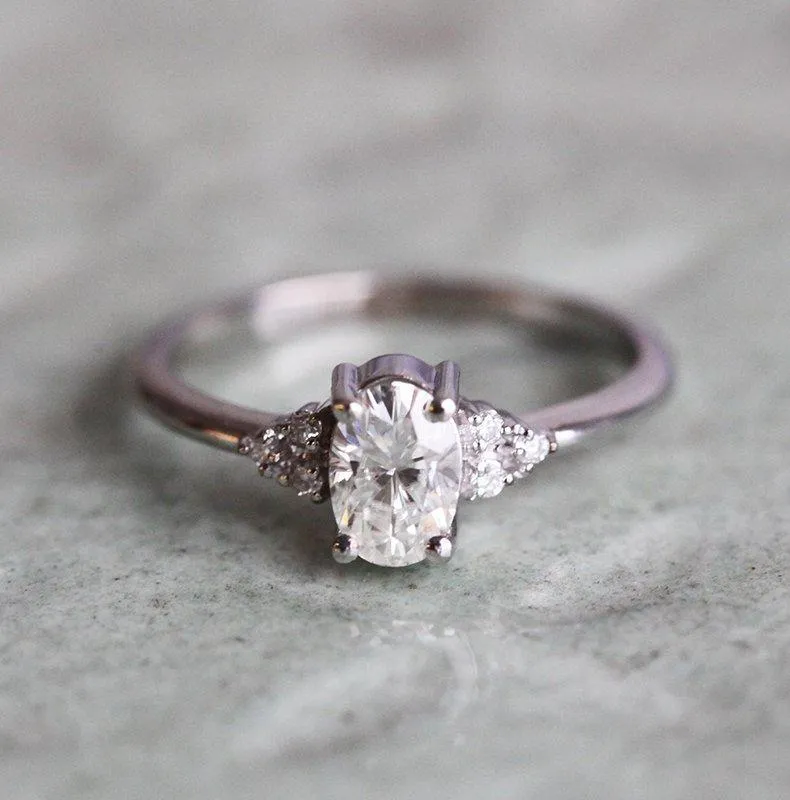 Oval Moissanite Ring With White Side Diamonds view 2