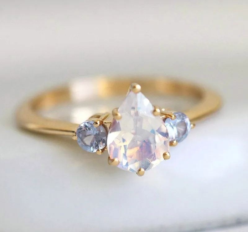 Pear Rainbow Moonstone Ring With Light Blue Sapphires view 10