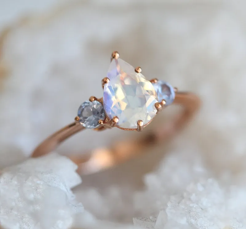 Pear Rainbow Moonstone Ring With Light Blue Sapphires view 6