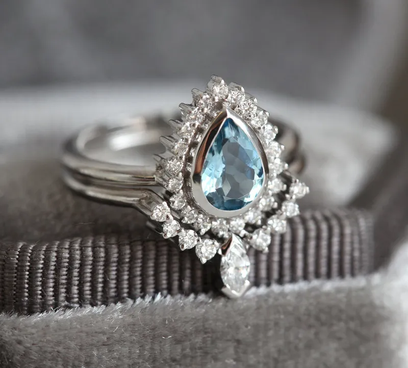 PEAR-CUT AQUAMARINE RING SET WITH DIAMOND HALO AND MARQUISE BAND view 9