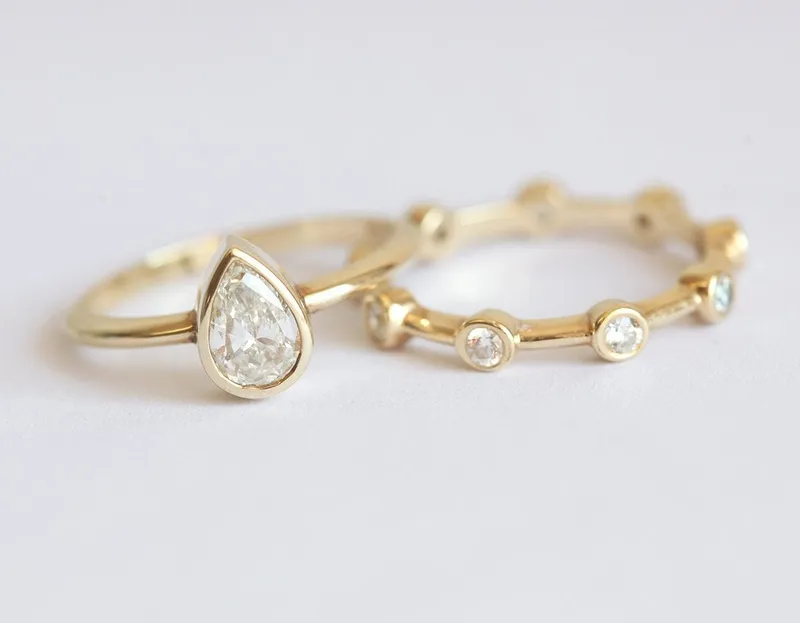 Pear Diamond Solitaire Ring With Studded Wedding Band pear cut engagement ring