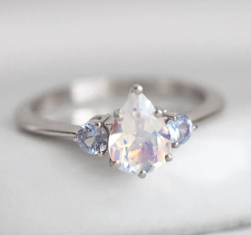 Pear Rainbow Moonstone Ring With Light Blue Sapphires view 11