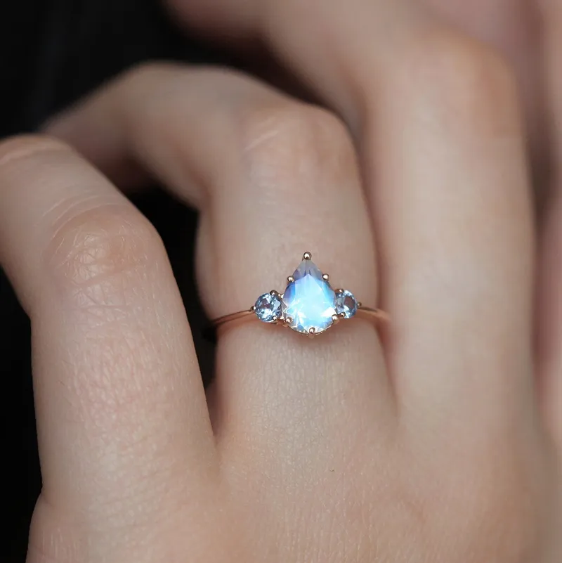 Pear Rainbow Moonstone Ring With Light Blue Sapphires view 5