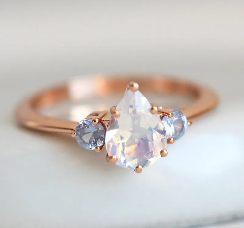 Pear Rainbow Moonstone Ring With Light Blue Sapphires view 7