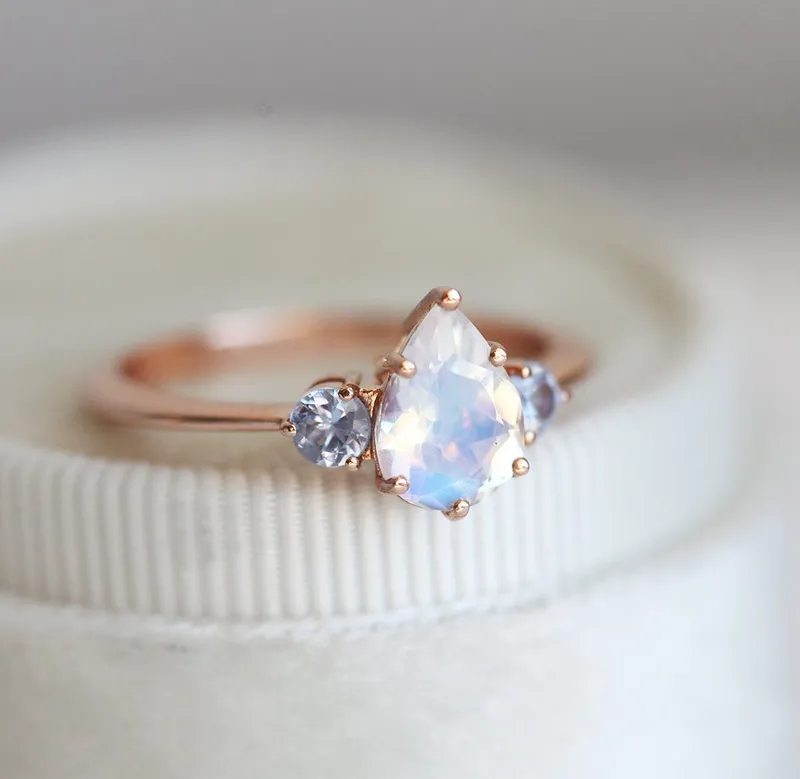 Pear Rainbow Moonstone Ring With Light Blue Sapphires view 8