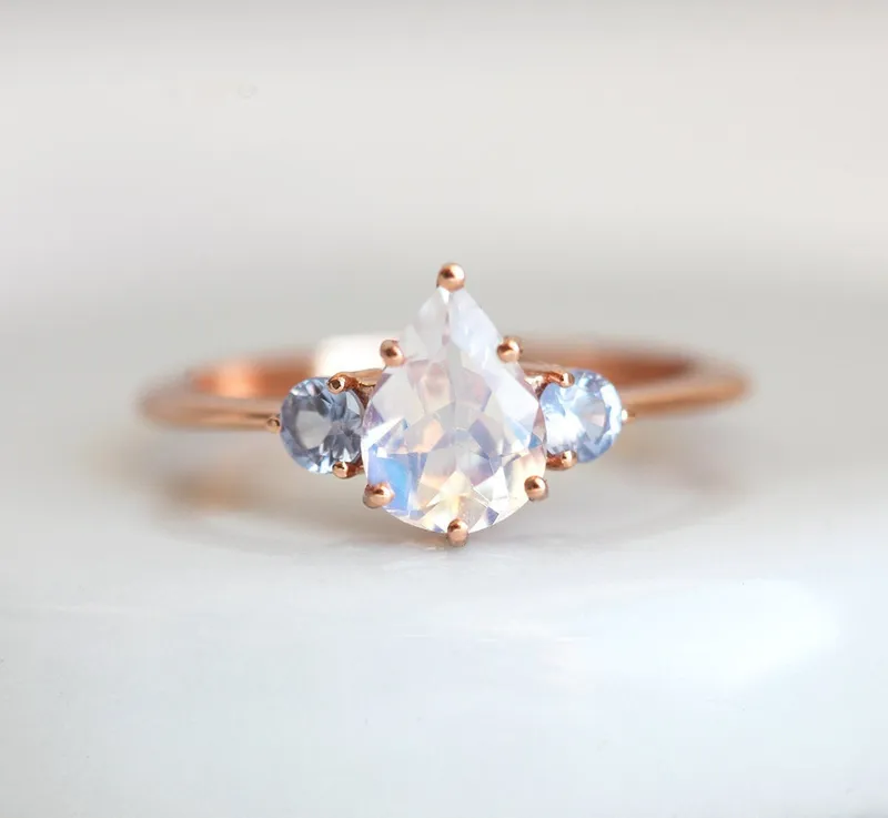 Pear Rainbow Moonstone Ring With Light Blue Sapphires view 4