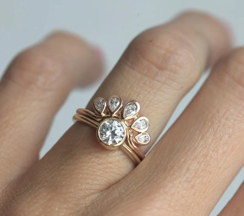Solitaire Diamond Ring With Curved Diamond Crown diamond round cut engagement ring