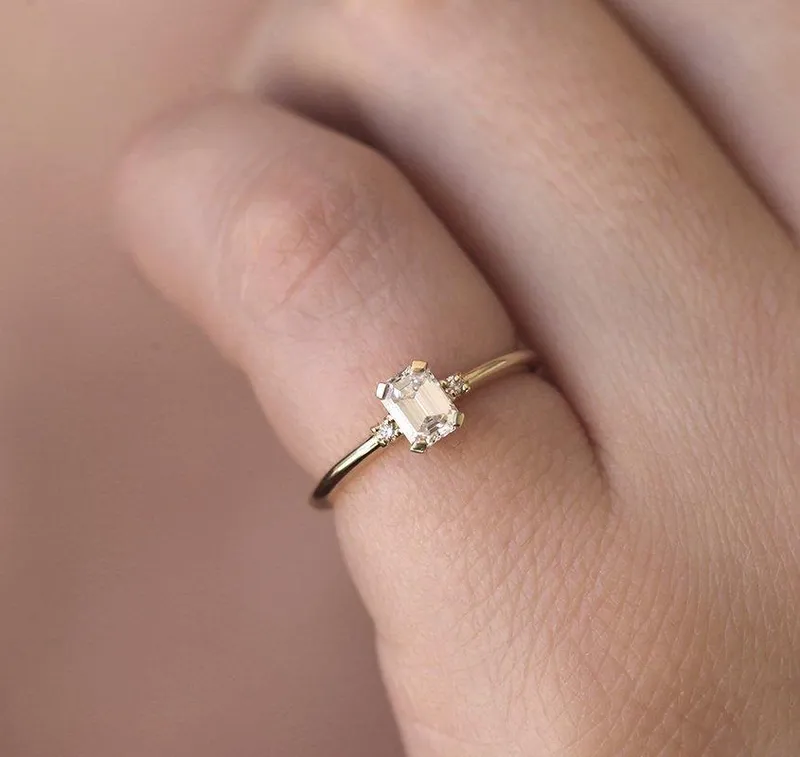 Sleek & Simple Emerald-Cut Diamond Ring With Side Diamonds view 3