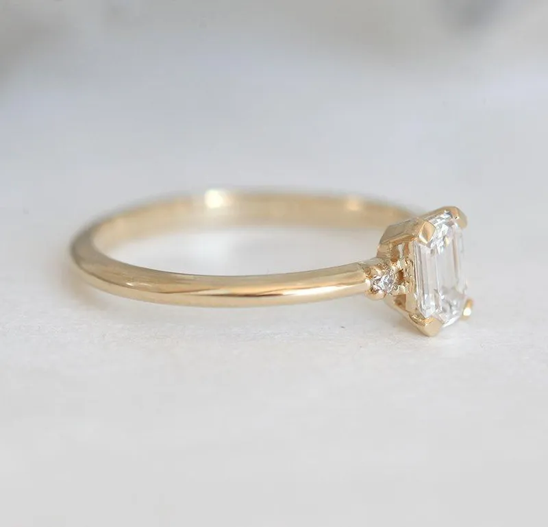 Sleek & Simple Emerald-Cut Diamond Ring With Side Diamonds view 7