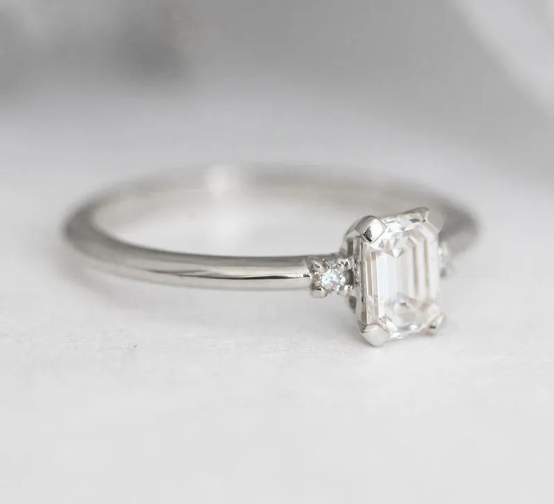 Sleek & Simple Emerald-Cut Diamond Ring With Side Diamonds view 9