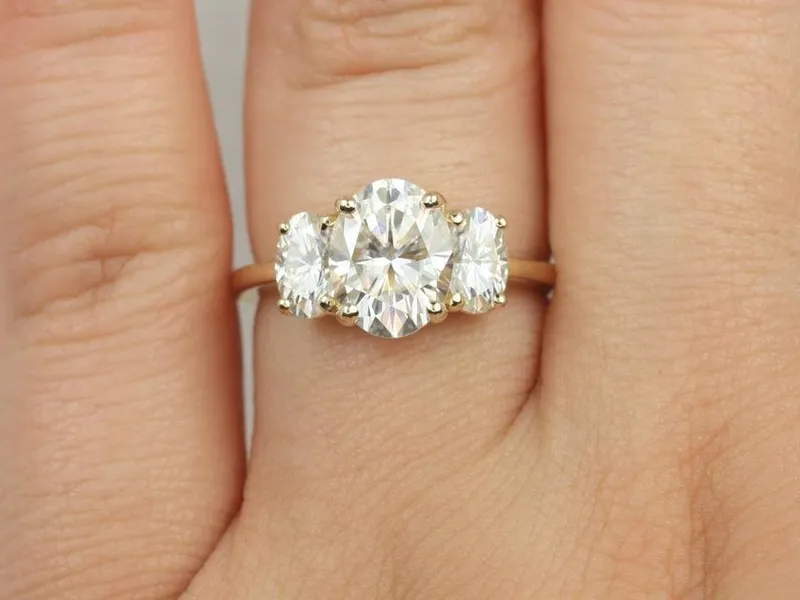 2cts Odessa 9x7mm 14kt Gold Moissanite Dainty 3 Stone Oval Engagement Ring view 5