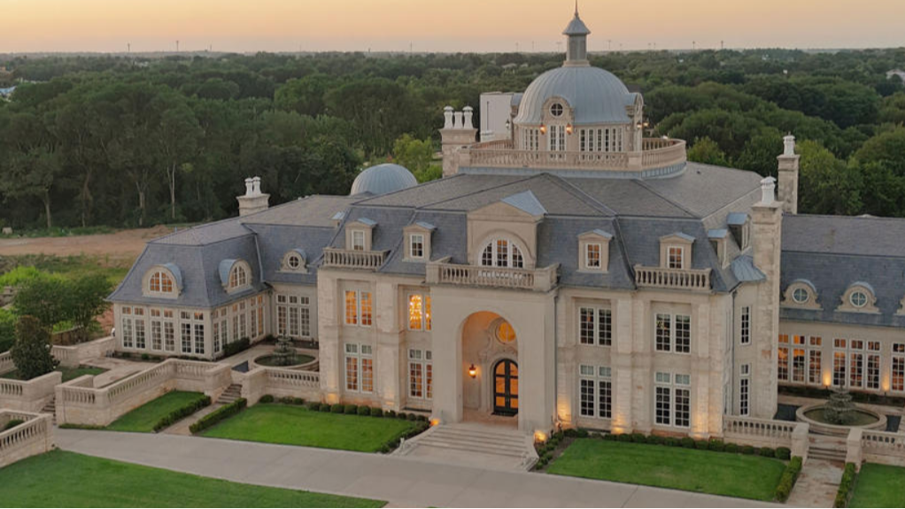 The Olana, Hickory Creek — an aerial view of the domed European-style mansion and its lawns at dusk