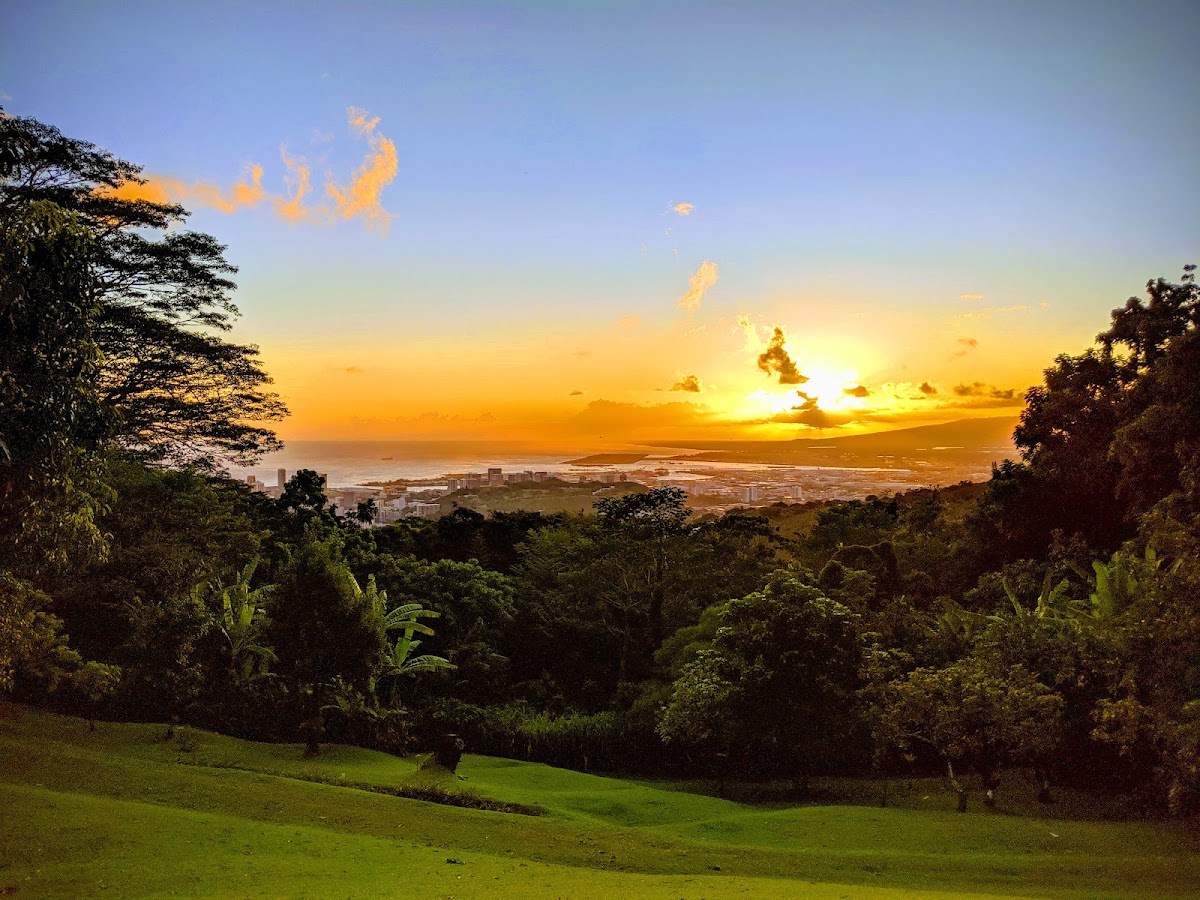Nutridge Estate, Honolulu — sunset over the city and coastline from a 1922 hilltop estate on Tantalus