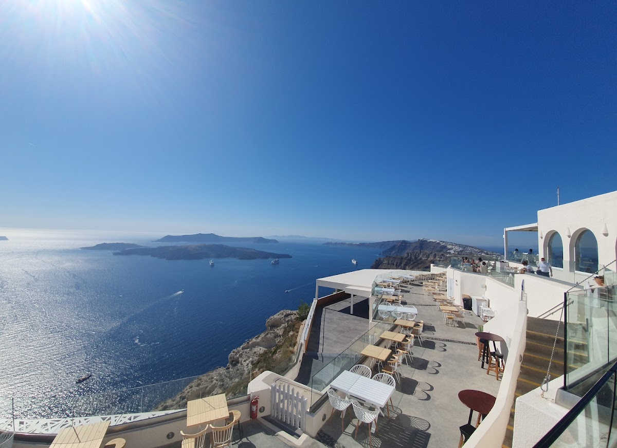 Santo Wines — cliffside cooperative winery wedding venue on the Pyrgos caldera ridge in Santorini with panoramic sunset views, capacity for 120 guests