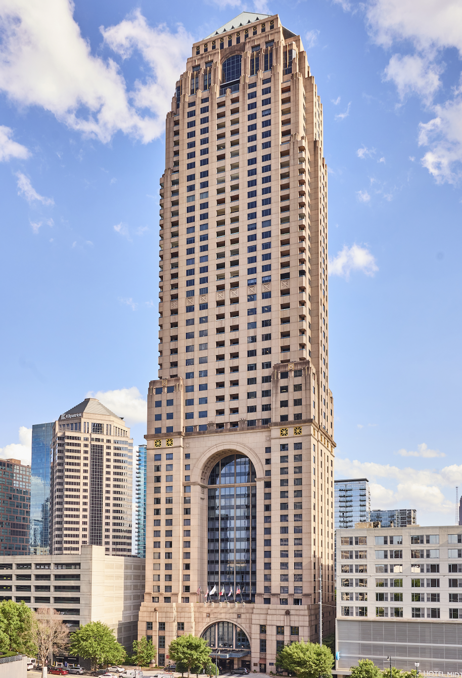 Four Seasons Hotel Atlanta — the hotel's Midtown tower against a blue sky