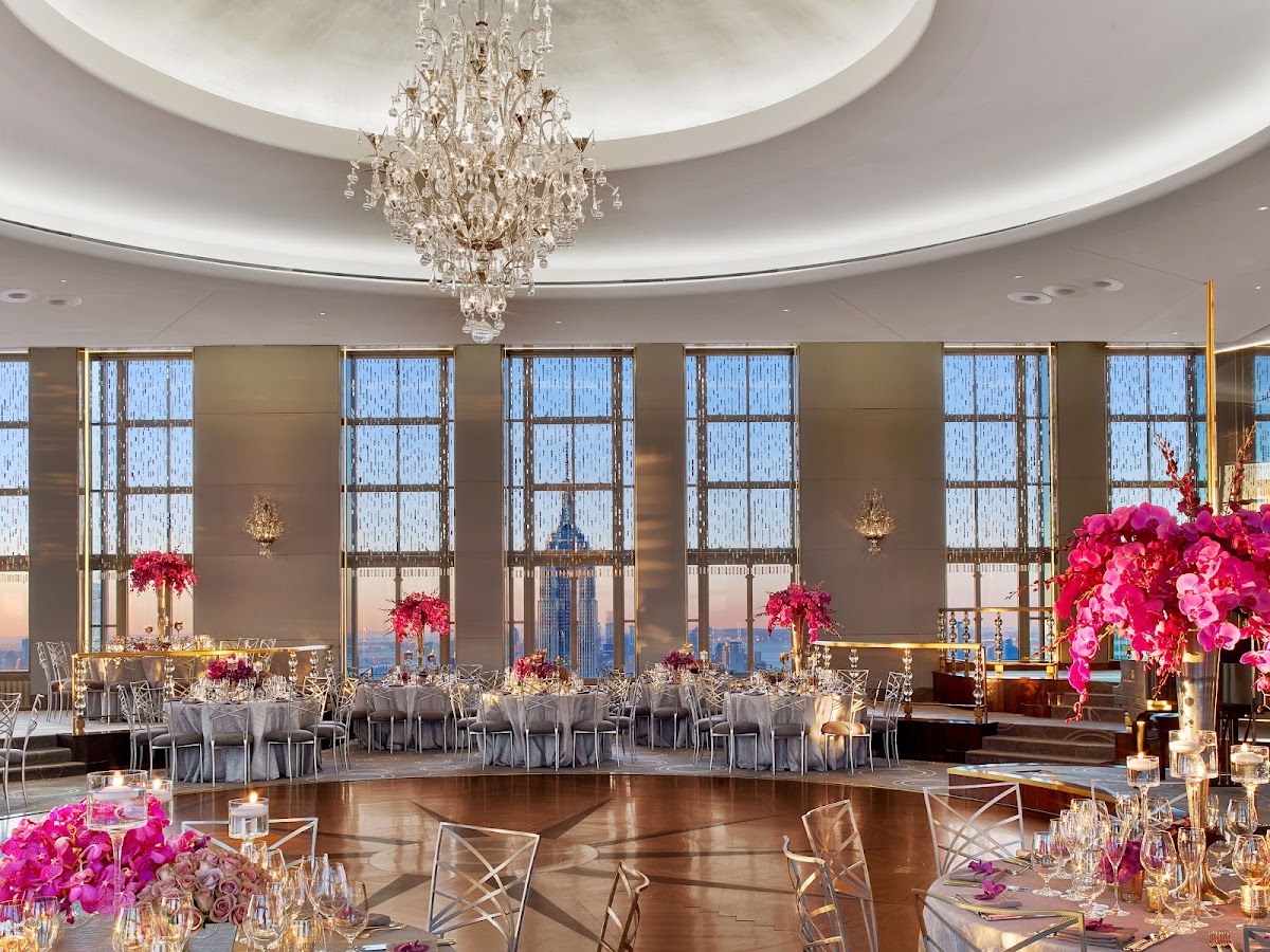 Rainbow Room, Rockefeller Center — a wedding reception set beneath a crystal chandelier and skyline windows