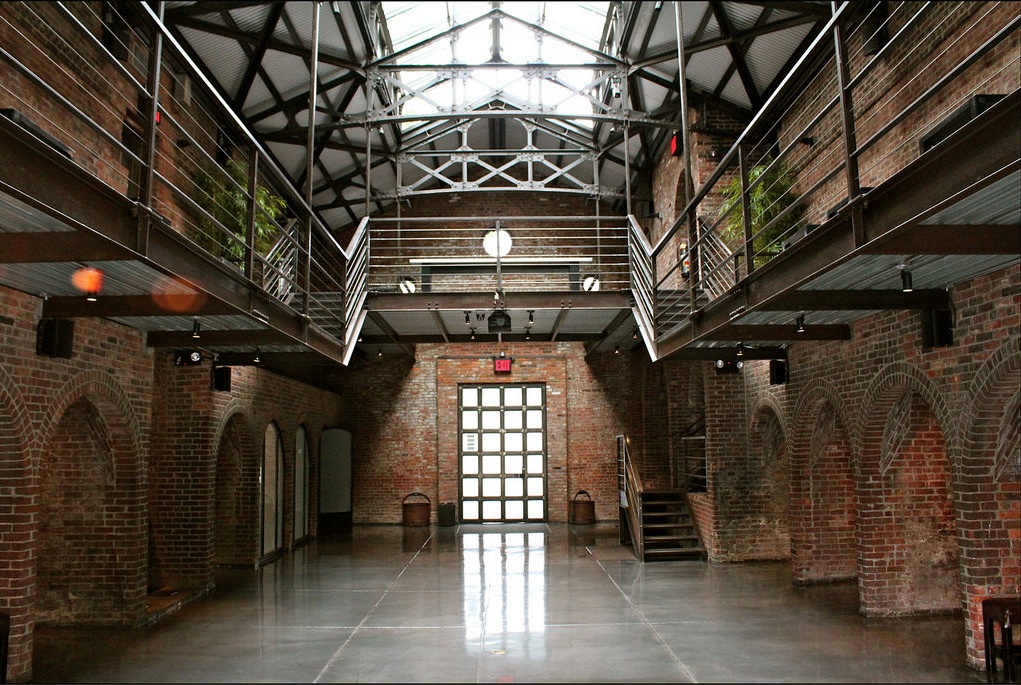 The Foundry, Long Island City — the exposed-brick main hall under its steel-framed skylight