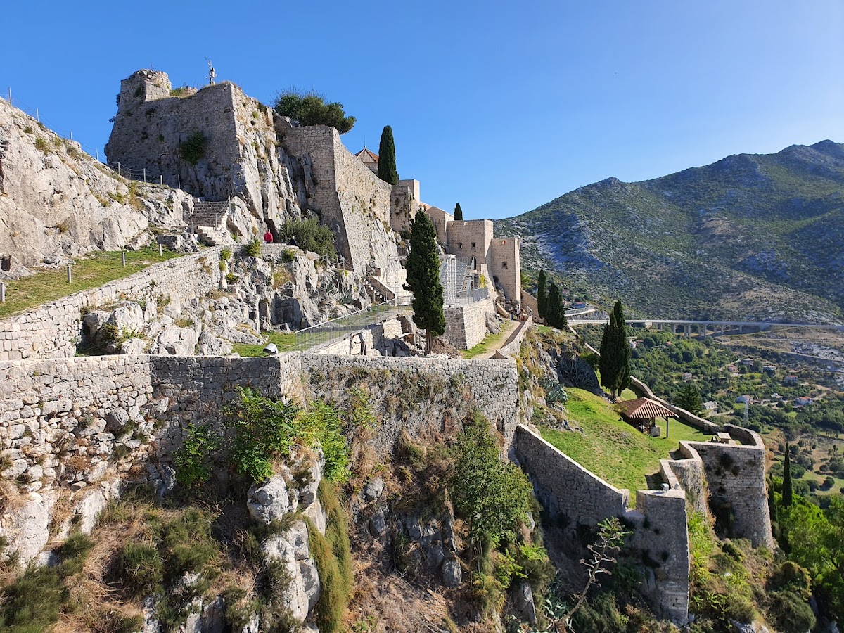 Klis Fortress near Split — legendary medieval fortress on a razor ridge between the mountains and sea (Game of Thrones' Meereen), with dramatic ceremony terraces and courtyard dinners for 150