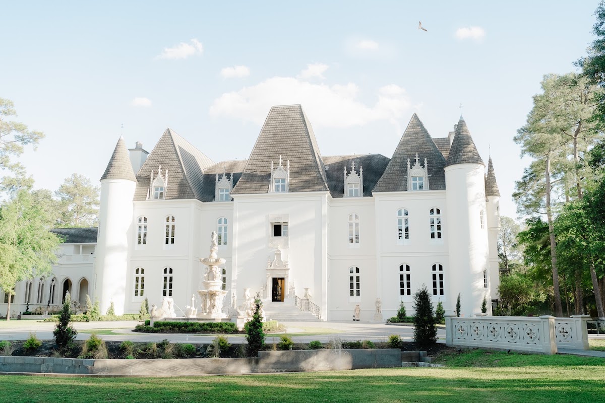 Chateau Nouvelle, Houston — the white turreted château behind its formal front garden