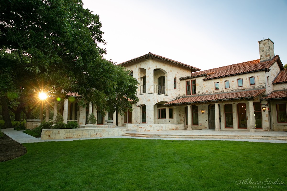 Garey House, Georgetown — the Tuscan-style villa and its lawn lit at dusk
