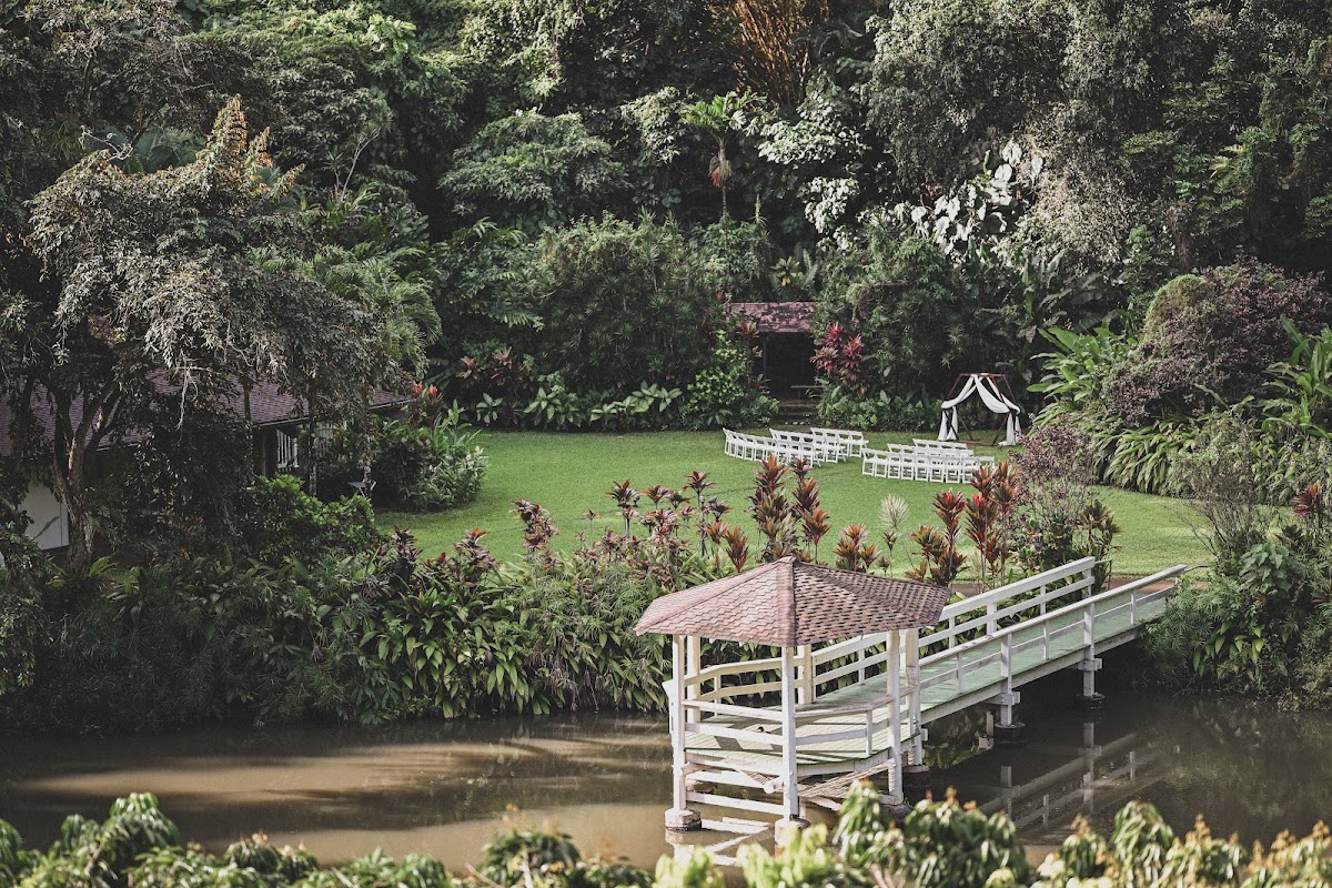 Haiku Gardens, Kāneʻohe — white ceremony gazebo over a tropical garden pond beneath the Koʻolau Mountains