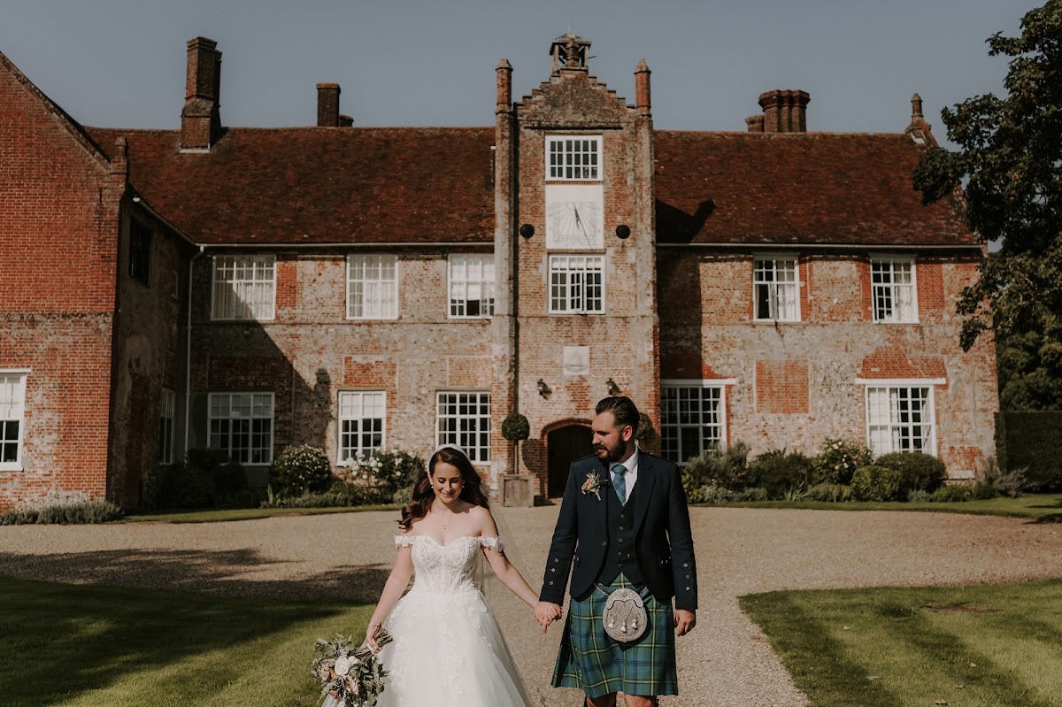 Bruisyard Country Estate, Suffolk — a couple in front of the red-brick Bruisyard Hall